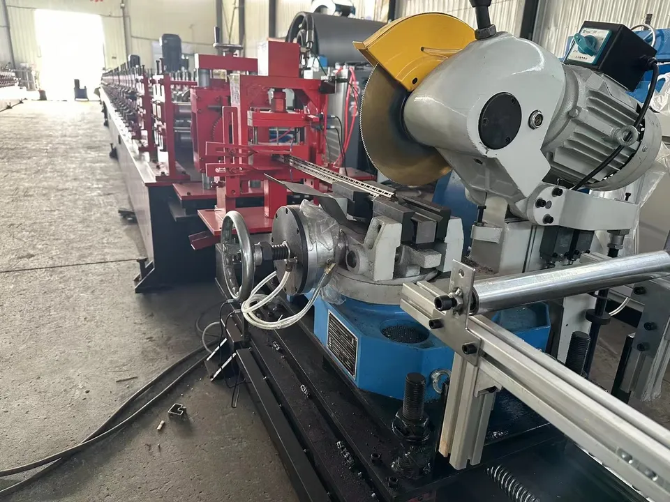 Guarded circular cutting blade and motor at the end of a forming line